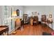 Spacious living room with hardwood floors, large windows, and stylish vintage furniture at 828 Ivy Ne Cv, Norcross, GA 30071