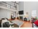 Bright living room features high ceilings, a fireplace, and an overhead view of the upper level at 828 Ivy Ne Cv, Norcross, GA 30071
