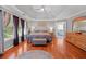 Spacious main bedroom with trey ceilings, large windows, and ensuite bathroom at 828 Ivy Ne Cv, Norcross, GA 30071
