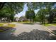 Peaceful neighborhood street with mature trees, manicured lawns, and well-maintained homes showcasing curb appeal at 828 Ivy Ne Cv, Norcross, GA 30071