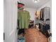 Well-organized walk-in closet features shelves and hanging space for clothing and accessories at 828 Ivy Ne Cv, Norcross, GA 30071
