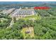 Located near Henry Town Center, an aerial view of the property surrounded by a canopy of mature trees at 133 Harold Dr, Mcdonough, GA 30253
