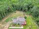 Aerial view of home featuring an attached deck surrounded by lush greenery at 133 Harold Dr, Mcdonough, GA 30253