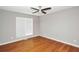 Bedroom with wood floors and modern ceiling fan at 133 Harold Dr, Mcdonough, GA 30253