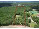 Aerial view of land, showcasing its boundary with mature trees and a residence at 133 Harold Dr, Mcdonough, GA 30253