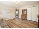 Bedroom with wood floors, sitting area, large closet, and decorative lighting at 3130 Crestmont Nw Way, Kennesaw, GA 30152