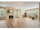 Versatile bonus room featuring a fireplace, hardwood flooring, ample natural light, and gym equipment at 3130 Crestmont Nw Way, Kennesaw, GA 30152