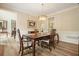 Elegant dining room with hardwood floors, a table with seating, and ample natural light at 3130 Crestmont Nw Way, Kennesaw, GA 30152