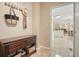 Inviting entryway with tiled floors, a wooden console table, and a view of the open-concept living space at 3130 Crestmont Nw Way, Kennesaw, GA 30152