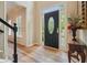 Elegant foyer featuring hardwood floors, a decorative front door, and staircase access at 3130 Crestmont Nw Way, Kennesaw, GA 30152