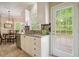 Bright kitchen area with modern appliances, granite countertops, and natural lighting at 3130 Crestmont Nw Way, Kennesaw, GA 30152