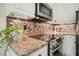 Elegant kitchen with granite countertops and modern appliances at 3130 Crestmont Nw Way, Kennesaw, GA 30152