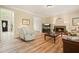 Spacious living room featuring hardwood floors, a fireplace, and plenty of comfortable seating at 3130 Crestmont Nw Way, Kennesaw, GA 30152