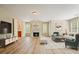 Bright living room with a fireplace, hardwood flooring, and comfortable seating area at 3130 Crestmont Nw Way, Kennesaw, GA 30152