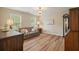 Cozy living room with wood floors, a floral sofa, and a writing desk with an adjacent hutch at 3130 Crestmont Nw Way, Kennesaw, GA 30152