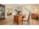 Comfortable home office space with a desk and chair, leading to the living room area at 3130 Crestmont Nw Way, Kennesaw, GA 30152