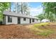 The home's backyard with a well-maintained lawn and partially visible exterior at 40 Melton Way, Covington, GA 30016