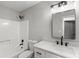 Modern bathroom with white fixtures, quartz countertops, and a white tiled shower at 40 Melton Way, Covington, GA 30016