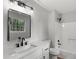 Modern bathroom with a white quartz countertop, sleek new fixtures and white tiled shower at 40 Melton Way, Covington, GA 30016