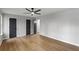 Bedroom featuring wood floors, grey walls and multiple closets at 40 Melton Way, Covington, GA 30016