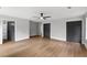 Spacious bedroom with wood floors, grey walls, a ceiling fan and closet space at 40 Melton Way, Covington, GA 30016