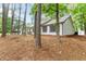 Side view of a single-story house with dark shutters and white siding at 40 Melton Way, Covington, GA 30016