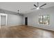 Bright living room with hardwood floors, neutral walls, and modern ceiling fans at 40 Melton Way, Covington, GA 30016