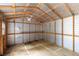 Interior view of shed with wooden framing, offering ample storage space and a functional design at 40 Melton Way, Covington, GA 30016