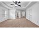 Open bedroom with neutral carpet, bright white walls, and ample doorway access at 7601 Watson Cir, Locust Grove, GA 30248