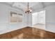 Elegant dining room with coffered ceilings, hardwood floors, and abundant natural light offers a cozy space at 7601 Watson Cir, Locust Grove, GA 30248