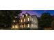 Stunning two-story home boasts a brick facade, inviting porch, and lush landscaping at 7601 Watson Cir, Locust Grove, GA 30248