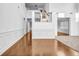 Bright foyer featuring hardwood floors, wainscoting, and high ceilings offers a grand entrance at 7601 Watson Cir, Locust Grove, GA 30248