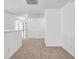 The well-lit hallway has plush carpet, with white doors and trim leading to other rooms at 7601 Watson Cir, Locust Grove, GA 30248