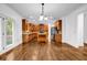 Spacious kitchen featuring stainless appliances, hardwood floors, a granite-topped island, and wooden cabinets at 7601 Watson Cir, Locust Grove, GA 30248