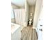 Bathroom featuring a shower-tub, toilet, and sink with modern fixtures and wood look flooring at , Covington, GA 30014