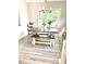 Dining area with farmhouse table set, natural light, and vinyl flooring at , Covington, GA 30014