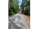 An asphalt path in a tree-lined area at , Covington, GA 30014