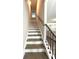 Elegant staircase featuring dark wood steps with white risers and a sleek, modern railing at , Covington, GA 30014