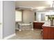 Bathroom featuring a soaking tub and vanity with a dark wood cabinet at 1252 Heritage Dr, Villa Rica, GA 30180
