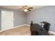 This room features a ceiling fan, neutral walls, and a closet door, offering a versatile space at 1252 Heritage Dr, Villa Rica, GA 30180