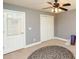 Bedroom with gray walls, storage closet, ceiling fan, and natural light, offering a cozy space at 1252 Heritage Dr, Villa Rica, GA 30180