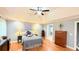 Bright bedroom with hardwood floors, a ceiling fan, and vaulted ceilings at 1252 Heritage Dr, Villa Rica, GA 30180