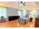 Bright bedroom with hardwood floors, a ceiling fan, and vaulted ceilings at 1252 Heritage Dr, Villa Rica, GA 30180