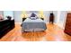 Bedroom features hardwood floors, neutral walls, and tasteful decor at 1252 Heritage Dr, Villa Rica, GA 30180