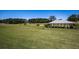 Expansive green space with a covered gazebo and golf carts. A perfect place to relax and play at 1252 Heritage Dr, Villa Rica, GA 30180