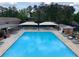 Spacious community pool with covered seating areas, offering a perfect place to relax and socialize at 1252 Heritage Dr, Villa Rica, GA 30180
