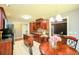 Eat-in kitchen with dark wood cabinets, stainless steel appliances, and a movable island at 1252 Heritage Dr, Villa Rica, GA 30180