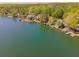 Aerial view of lakefront property with private boat docks and mature trees at 1252 Heritage Dr, Villa Rica, GA 30180