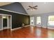 Open concept living space features vaulted ceilings and wood flooring at 1252 Heritage Dr, Villa Rica, GA 30180