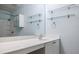 Bright bathroom featuring a large mirror, vanity, and glass shelving at 1293 Liberty Nw Pkwy, Atlanta, GA 30318